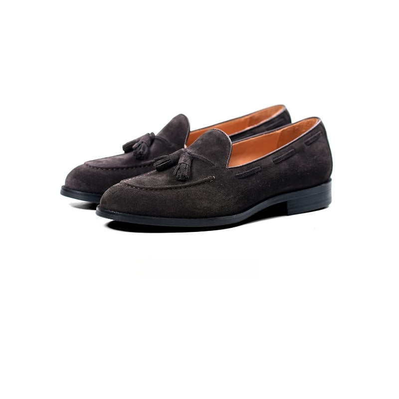 Lunepebbla tobacco suede tassel loafers worn with dark denim showing suede sheen on foot