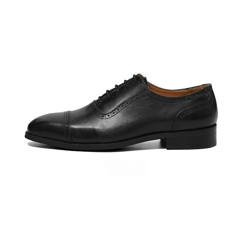 Lunepebbla close-up of quarter-brogue perforations on waxed calfskin cap-toe oxford