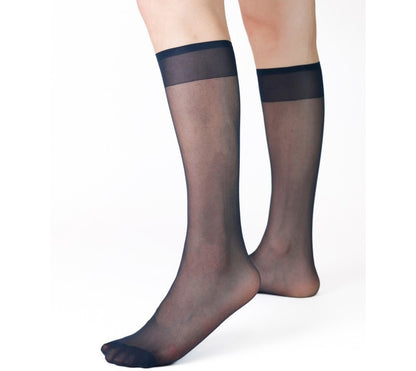Lunepebbla sheer dress socks worn with leather loafers showing ultra-thin fit inside shoe